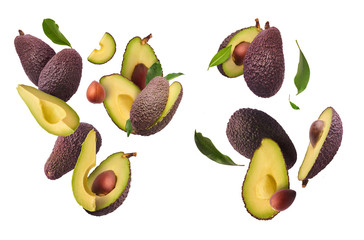 Creative collection set with Fresh ripe avocado with leaves falling in the air.