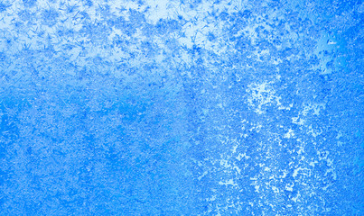 Fototapeta na wymiar Ice flowers and frozen window macro view. Frost texture pattern. cold winter weather xmas background concept