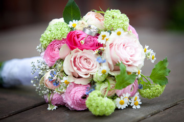 Bridal Bouquet flowers pink rose on ground