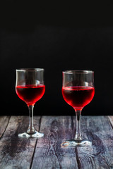 Pink wine. Wine in a glass near fruits and grapes. Traditional Georgian wine according to ancient technology. Copy space Close up and vertical orientation.