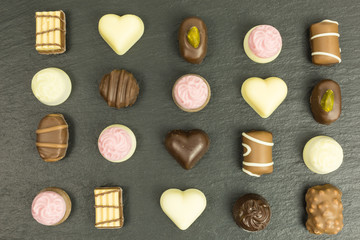 background of different chocolate pralines
