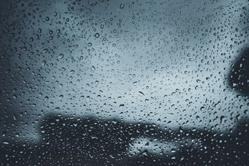 Water droplets on the glass And umbrellas