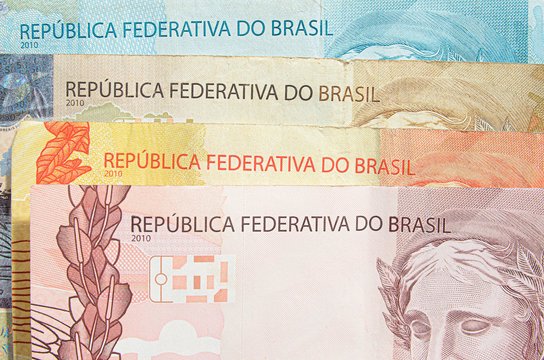 Brazilian real banknotes background. 10, 20, 50, 100 reais brl. Brazilian money, real notes. Macro photo.