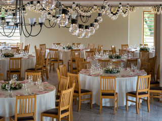 Tables set for wedding under light decorations