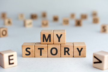 my story - words from wooden blocks with letters, my story concept story of my life, random letters...