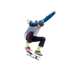 Teenager skateboarder jumps ollie on an isolated white background. The concept of street sports and...