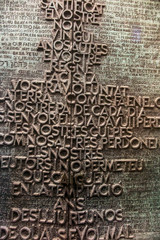 Barcelona, Spain, June 22 2019: Fragment of the Sagrada Familia basilica designed by Antonio Gaudi - one of the external doors with the prayer of Our Father