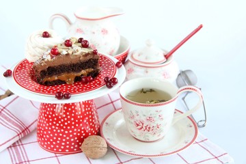 chocolate cake with cranberries and a Cup of tea
