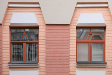 Wall of vintage building with beautiful windows
