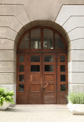 Fototapeta na wymiar Building with vintage wooden door. Exterior design