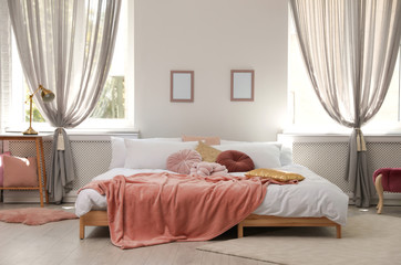 Stylish modern room interior with comfortable double bed