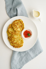 Zucchini pancakes with potato and red caviar, fodmap keto diet top view