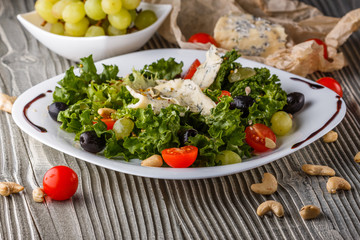 salad provence with blue cheese on wooden table