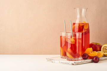 Stewed fruits in Glass Tube on pastel background side view copy space