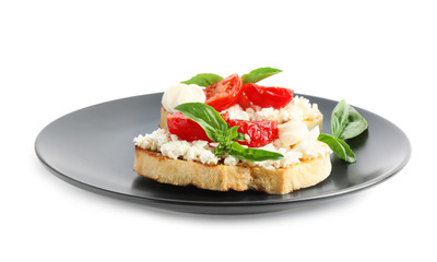 Tasty fresh tomato bruschettas on white background