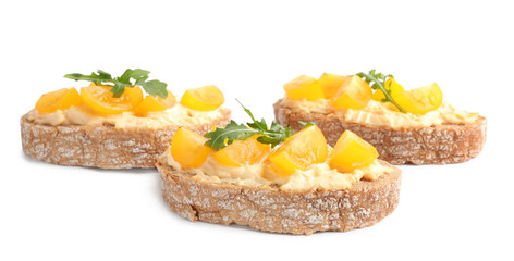 Tasty fresh tomato bruschettas on white background