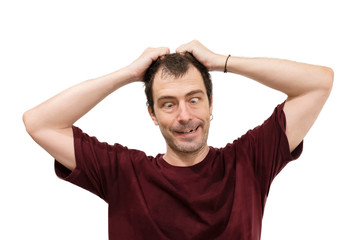 Fototapeta premium Portrait of a crazy man grab his hair with smile