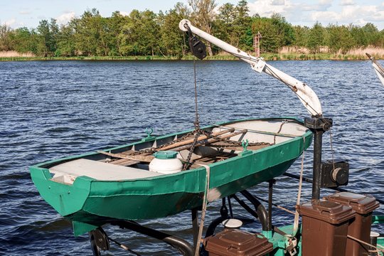 Green Old Metalic Boat On A Bunker Barge.