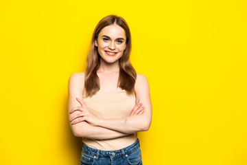 Portarit of cute nice woman standing isolated on yellow background