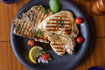 cooked beef steak on dish reaty to eat