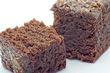 Beet brownie cube pieces on white background