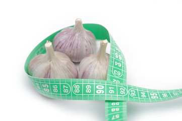 Garlic for weight loss isolated on white. Fresh garlic helps lose excess calories