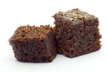 Beet brownie cube pieces on white background