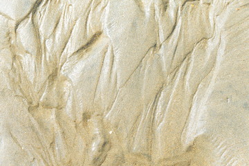 Marcas de agua en arena de playa