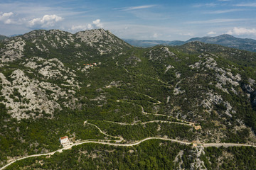 Aerial view of a mountain road leading to river Crnojevica near lake Skadar. Lake Skadar National Park, Montenegro.