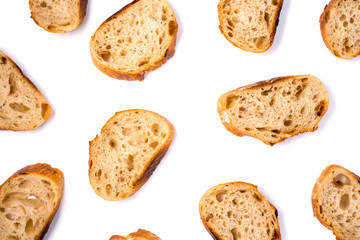 Pattern with pieces of white bread isolated on white background. Top view.