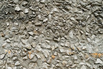 Background from pebbles texture with cement. The texture is a large stone of gray color on a flat.