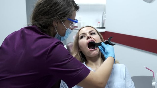 woman visiting the dentist for her annual cleaning and check up