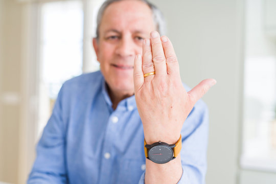 Close up of man hand showing alliance ring