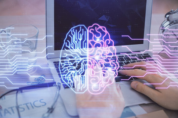 Man typing on keyboard background with brain hologram. Concept of big Data.