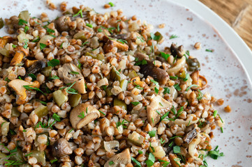 buckwheat porridge with mushrooms and salted cucumber
