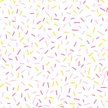 Colorful seamless vector confetti pattern. Bakery themed donut, doughnut or cupcake sugar sprinkle background.