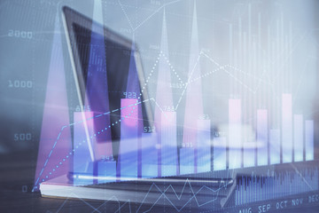 Stock market graph and table with computer background. Double exposure. Concept of financial analysis.