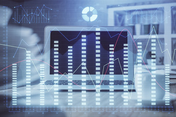 Double exposure of forex chart and work space with computer. Concept of international online trading.