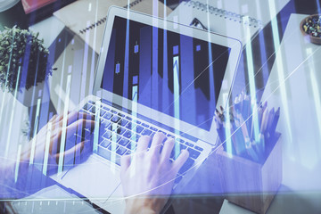 Multi exposure of businessman working on laptop on background. International business hologram in front. Concept of success.