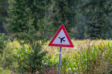 a  warning sign indicating flight operations