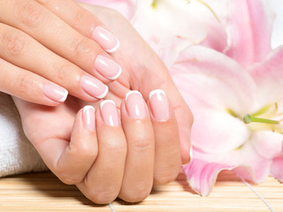 Obraz na płótnie Canvas Beautiful woman's nails with french manicure