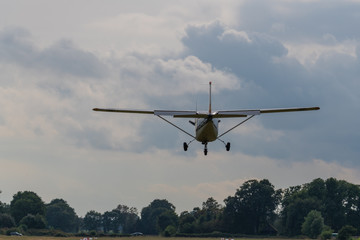 a landing plane on a gray  background