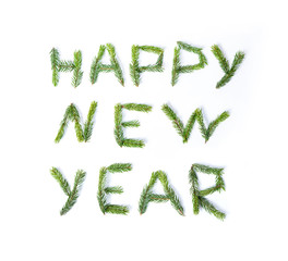 HAPPY NEW YEAR made of spruce twigs.