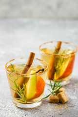Spiced pear cider with rosemary and cinnamon. Selective focus, copy space.