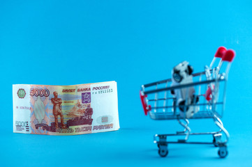 grocery cart on the money, Russian money, five thousand rubles, the background image