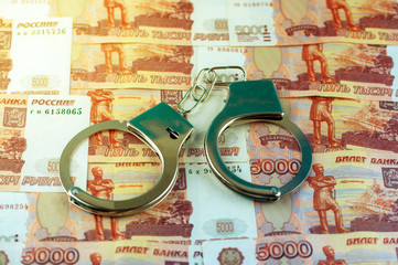 handcuffs on Russian money, five thousand rubles, background image
