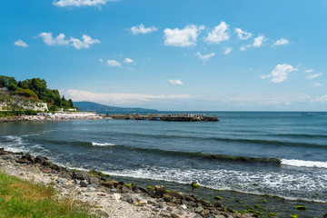 Rocky shore over the beautiful Black Sea, in Nessebar, Bulgaria. In the background a sky with clouds.