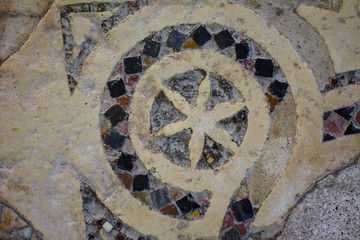 Ancient colored mosaic on the floor of a religious building. Concept - Antiquity
