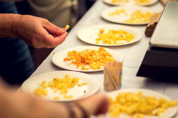 Custumers taste different kinds of cheese at cheese festival. Organic and farm food
