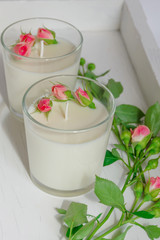 Сandle making - Handmade soy wax candle in glass on white background. Front view. Healthy lifestyle concept